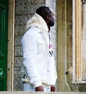 Nathan Palmer wearing Perverse Demand's Cream Denim Jacket and Cream Oversized Hoodie