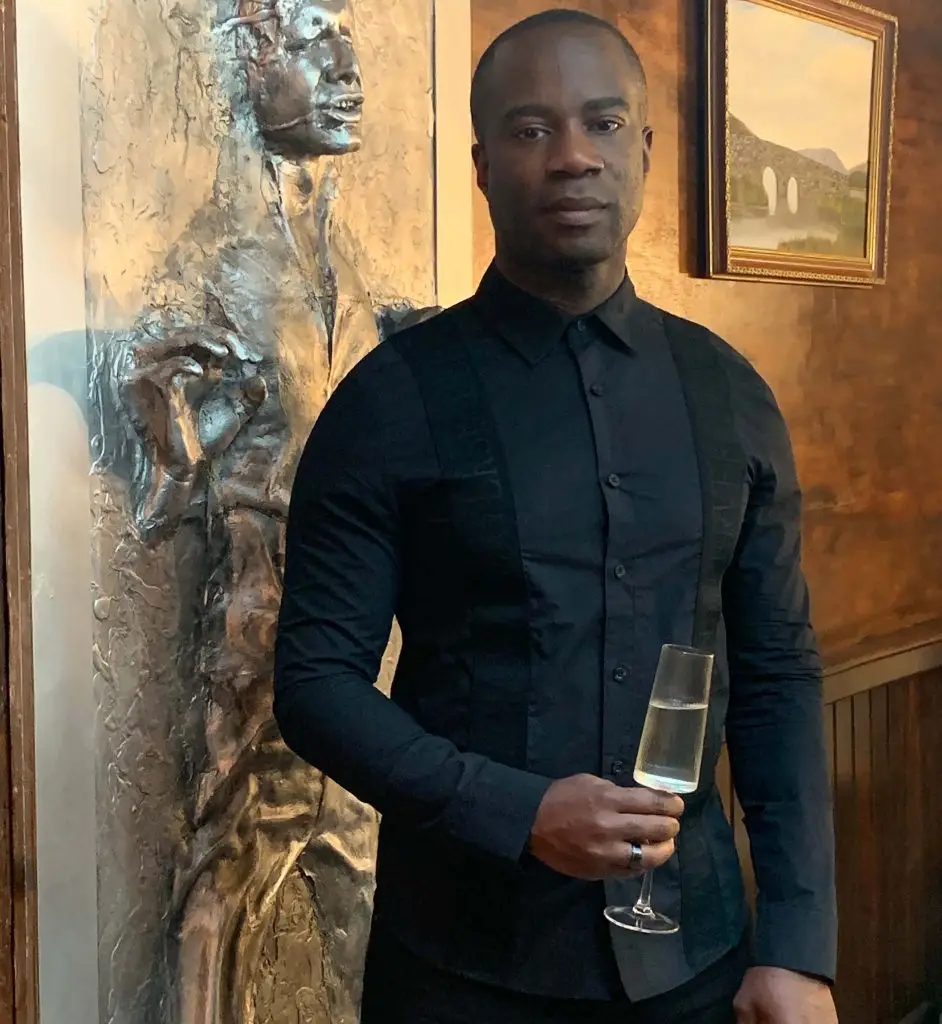 Nathan Palmer's streetwear style modeling our black cotton shirt with signature tape detail.